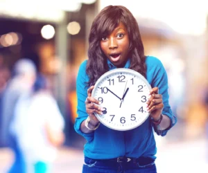 Woman holding clock. Time to make choices